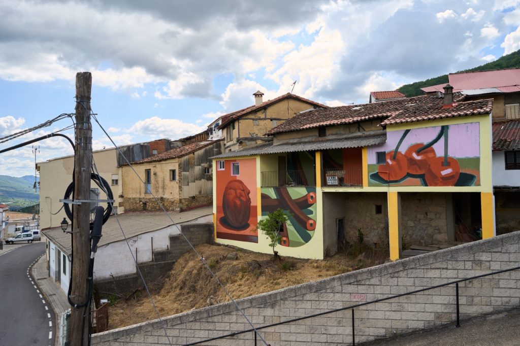 Abstract mural composition by MOTS in Spain. Muro Critico fstoval.
On the mural you can see cherries, abstract shapes, surreal character
 